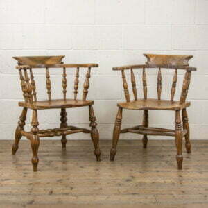 Two Similar Antique Elm Captain’s Chairs